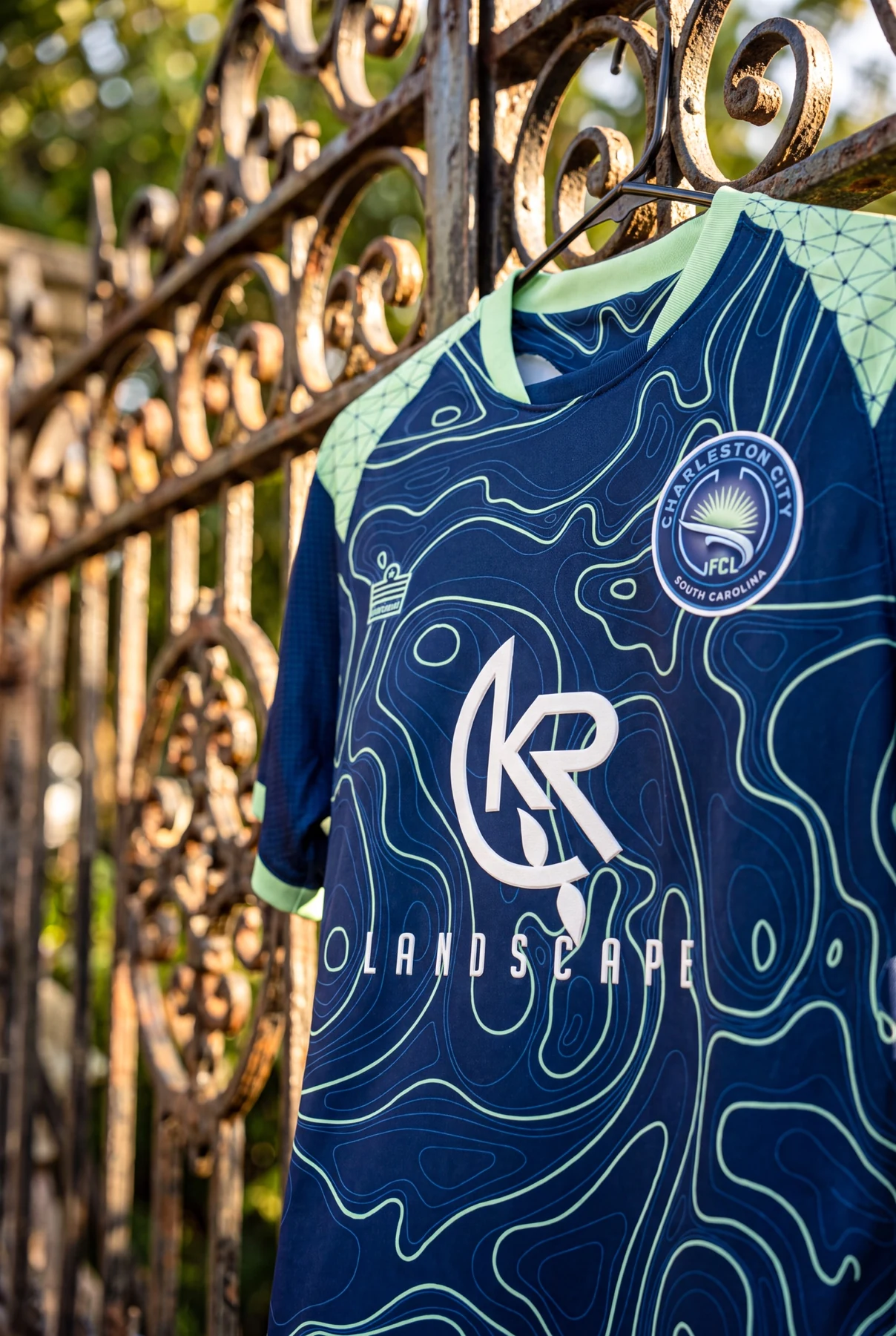 Boys navy and teal away kit